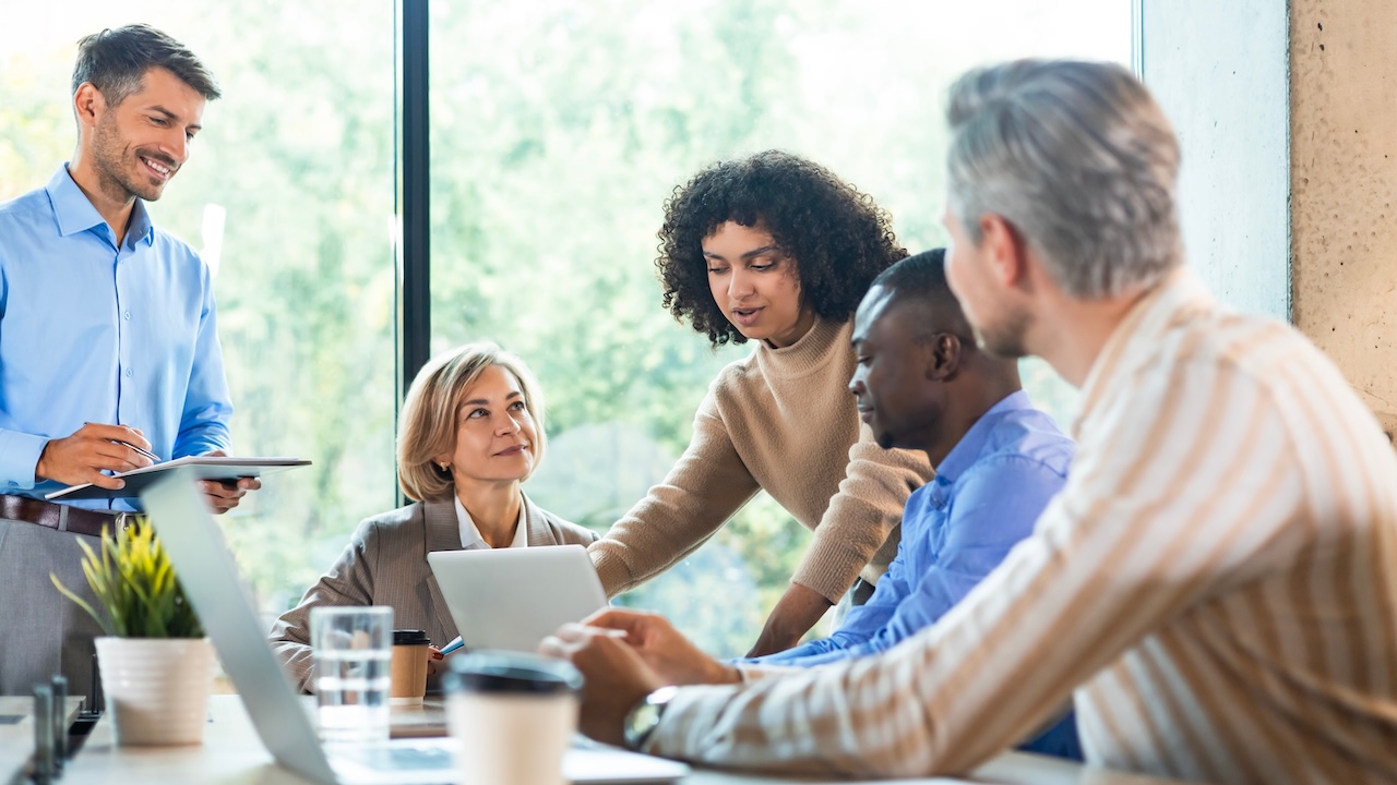 Business,Team,Discussing,Together,Business,Plans,In,Office